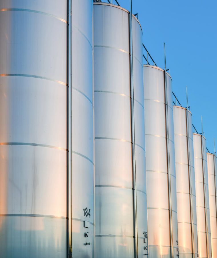 close-up-metallic-wine-barrels-winery (1)